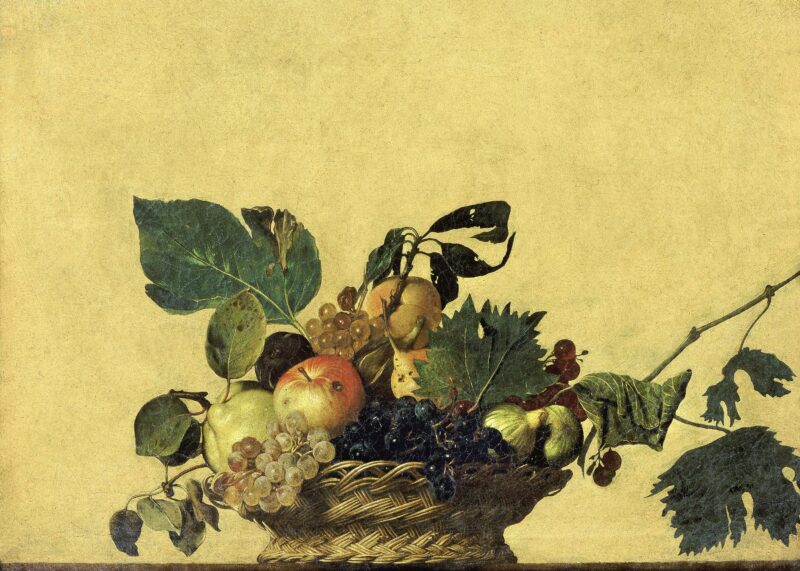 2.Basket_of_Fruit-Caravaggio_(c.1595) Caravaggio obraz o tytule "Koszyk z owocami" z około 1597-1600 roku. Na głównym planie kosz wiklinowy z winogronami, jabłkami, gruszkami i liśćmi. Za nim jednokolorowe tło.