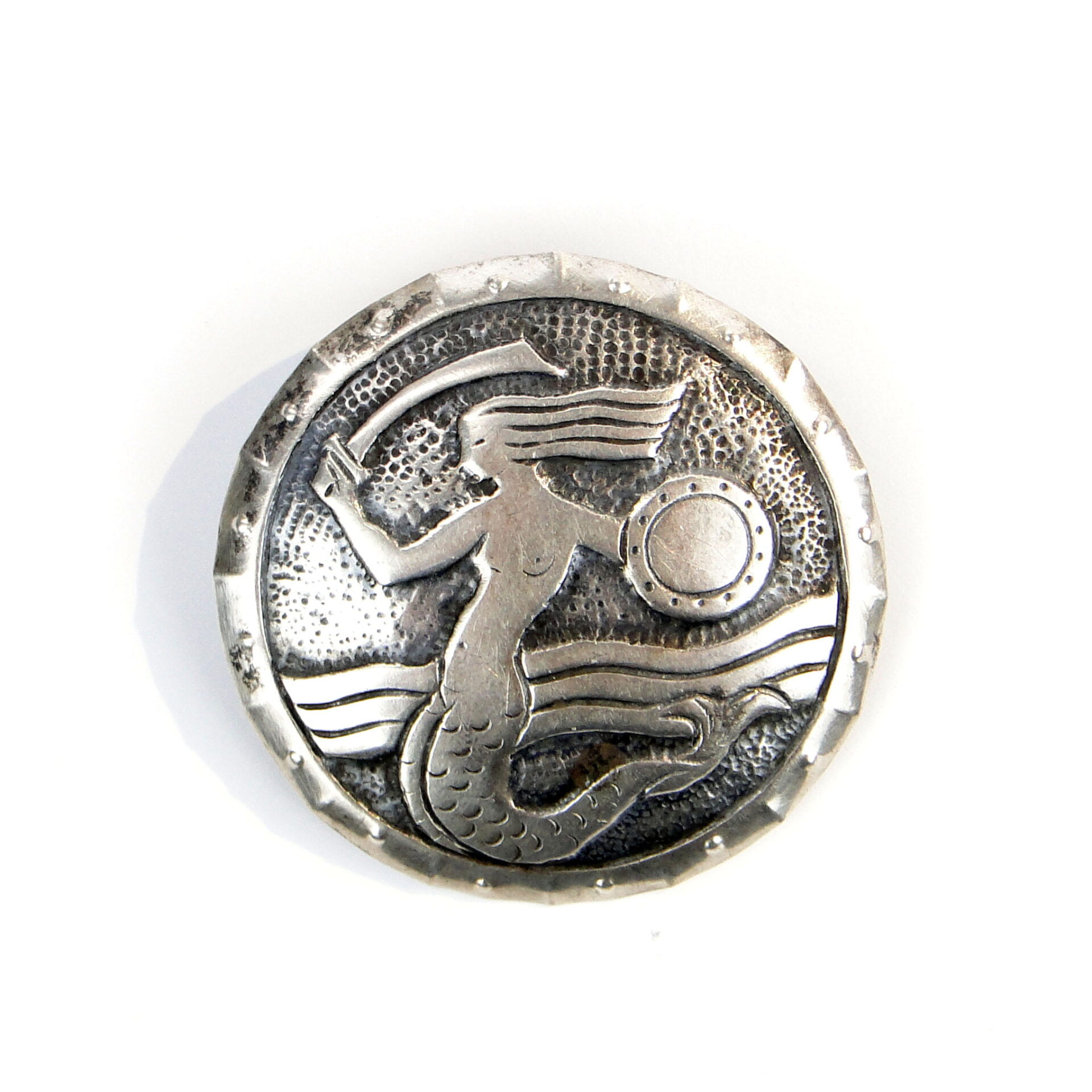 "Varsovia,", srebrna broszka. J. Fajngold 1963 r.